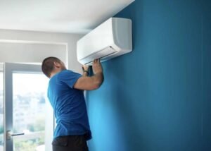 man installing ac
