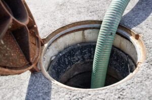 man fixing sewer
